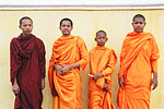 Four novice monks pose for a foreign tourist in the capital.