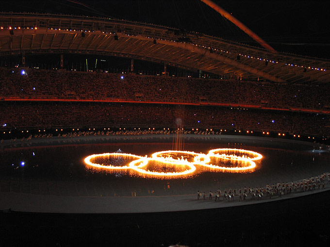 More than 75,000 people inside the stadium watched as the five Olympic rings in the middle of an artificial lake were set ablaze by a comet during a spectacular opening.