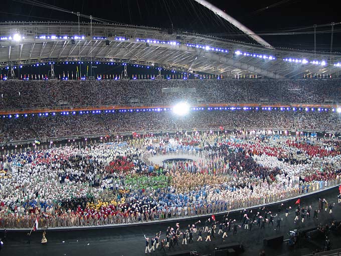 More than 10,000 of the world's best athletes poured into the Olympic stadium for the opening ceremony to the sounds of techno music.