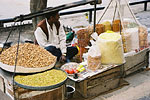 A vendor selling peanuts on the streets of the capital.