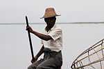 A Burmese fisherman at work on the calm waters of Inle lake, in the country's north-east. The lake features about 17 villages on stilts, inhabited mainly by the Intha people.
