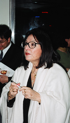 The internationally acclaimed Greek-born singer Nana Mouskouri signs autographs after performing for Chinese and foreign concert-goers.