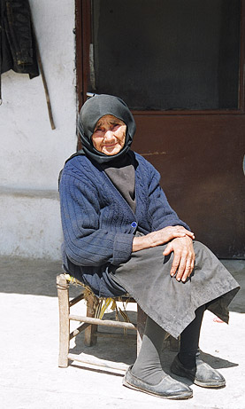 An elderly relative outside her simple village home in Argos, in the southern Peloponnese.