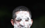 Steve Mencarini takes a pie in the face for charity at Elon University.
