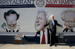 Former President Bill Clinton stops by a mural commemorating the 1992 New Hampshire Primary as he arrives at the Merrimack Restaurant in downtown Manchester, N.H. Clinton was in town to deliver a keynote speech at a local college.