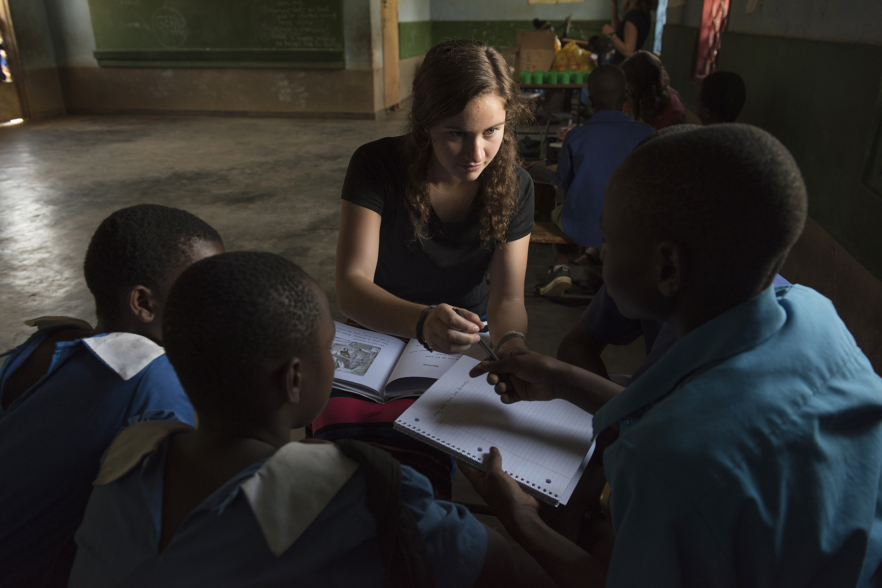 Although these Malawian children have English skills, their reading comprehension skills are low. The American students brought books and writing materials from the U.S. for the English lessons. 