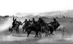 A Friday Buzkashi match in Kabul. The sport is a battle, on horses, over a headless goat.