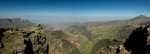This is a stitched panorama of five images, looking NNW along the escarpment from the viewpoint at Chennek in the Simien Mountains National Park, Ethiopia. The cliffs fall away from this point by over 1000m