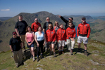 Pete Royall of Wandering Aengus Treks with a group of walkers on Fleetwith Pike looking over Buttermere.