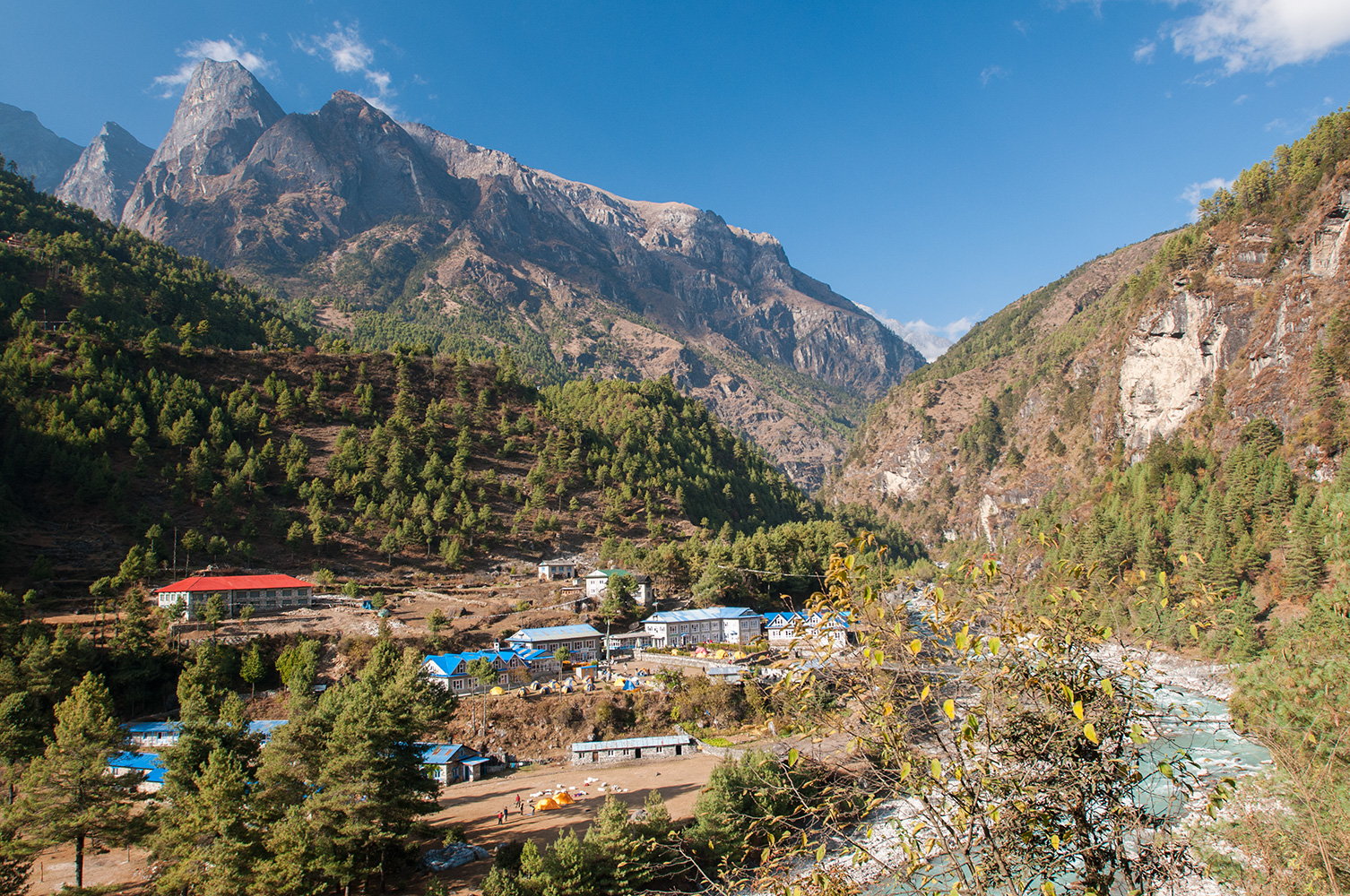 This is the place where the trail from the airstrip at Lukla to Namche Bazaar and Everest crosses the Milke Danda river. These days, during the peak trekking seson, over a hundred flights a day service lukla, and there are thousands of trekkers passing each way every day. Given that most of them will not be carrying their own luggage, but will have either porters or yaks with them, the volume of traffic on the trail can be imagined. It is a circus. Waits of several hours are not uncommon here, as one-way traffic streams across the narrow suspension bridge over the river. Consequently many tea shops and lodges have sprung up...Nikon D300, 17-35mm. November 2008