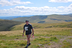 Fell runner from Hesket Newmarket, Cumbria, on the summit of High Pike towards the end of the Old Crown Round in 2009. Pearson won the event, completing the 24 mile round of the Caldbeck Fells in 4hrs 14minutes. 