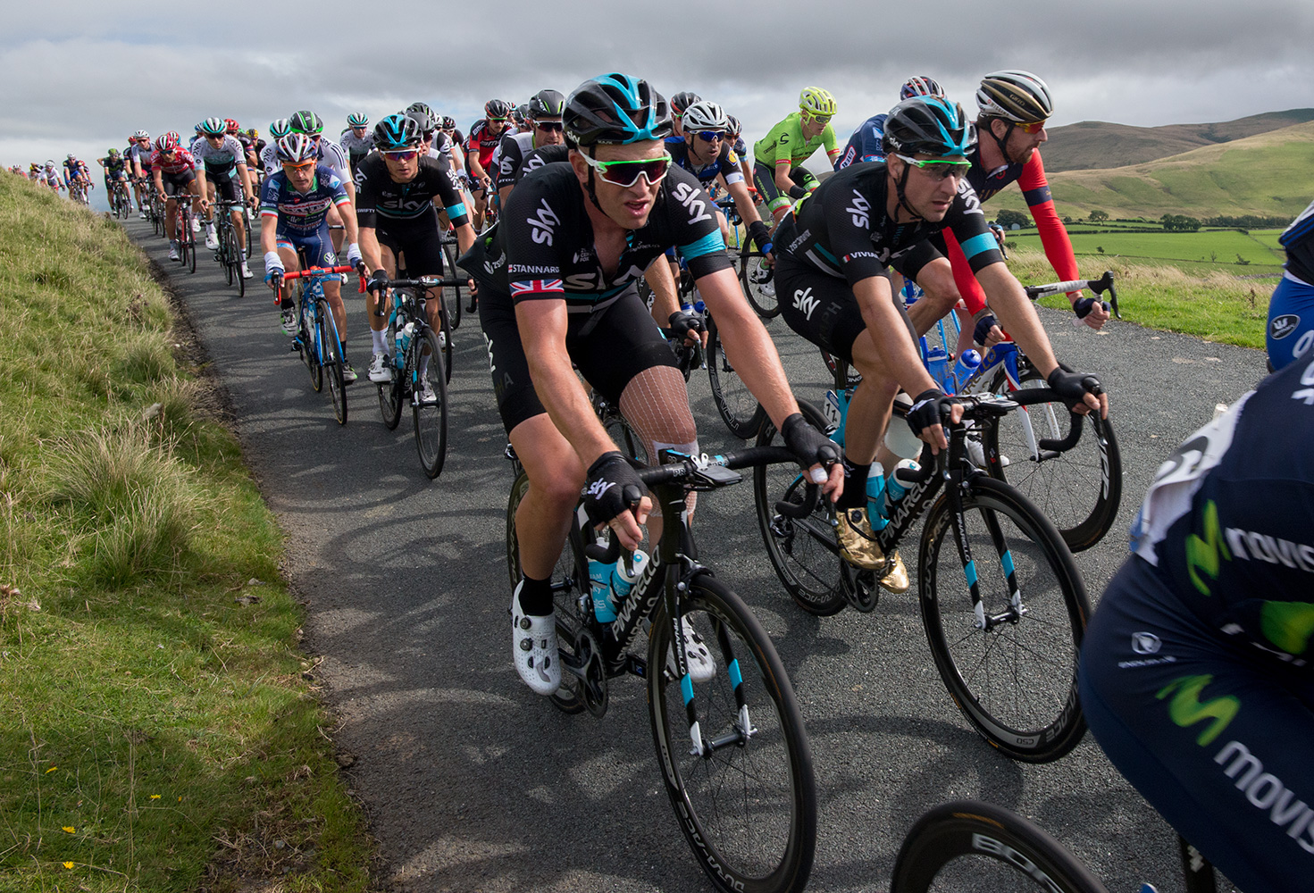 Bradley Wiggins and riders from Teak Sky in the peleton as it crosses Caldbeck Commons in Cumbria during Stage 2