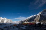 As the afternoon shadows engulf the camp, temperatures plummet. A view down valley to Paiju Peak and the Trangos etc