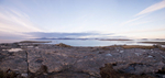 A panorama of four images, looking north over the Sound of Barra to Eriskay and Uist from Beinn Sgurabhal