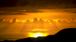 The sun dips towards the horizon behind a bank of cloud - taken from near Hopa, Eastern AnatoliaNikon F5, 180mm, Fuji Velvia 100
