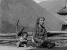 Chhetri child and grandmother Relaxing in the afternoon sunshine at Simikot, HumlaBronica ETRSi, 70mm, Ilford HP5 @ 800asa