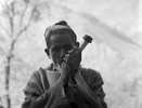 A Chhetri man smoking his sulpa or chillum pipe at a chai shop below Simikot in the Humla Karnali valley, Western Nepal
