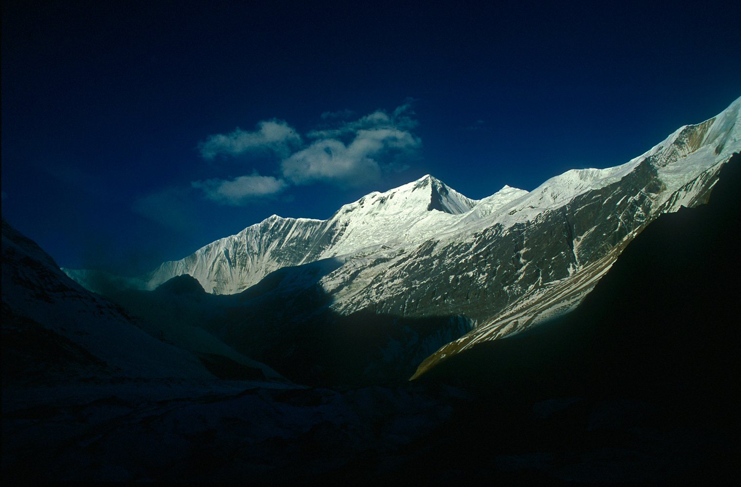 A panorama of Dhaulagiri II (on the right), III (7715m) and V (7618m) from base camp.Nikon FM2, 24mm, Fuji Velvia