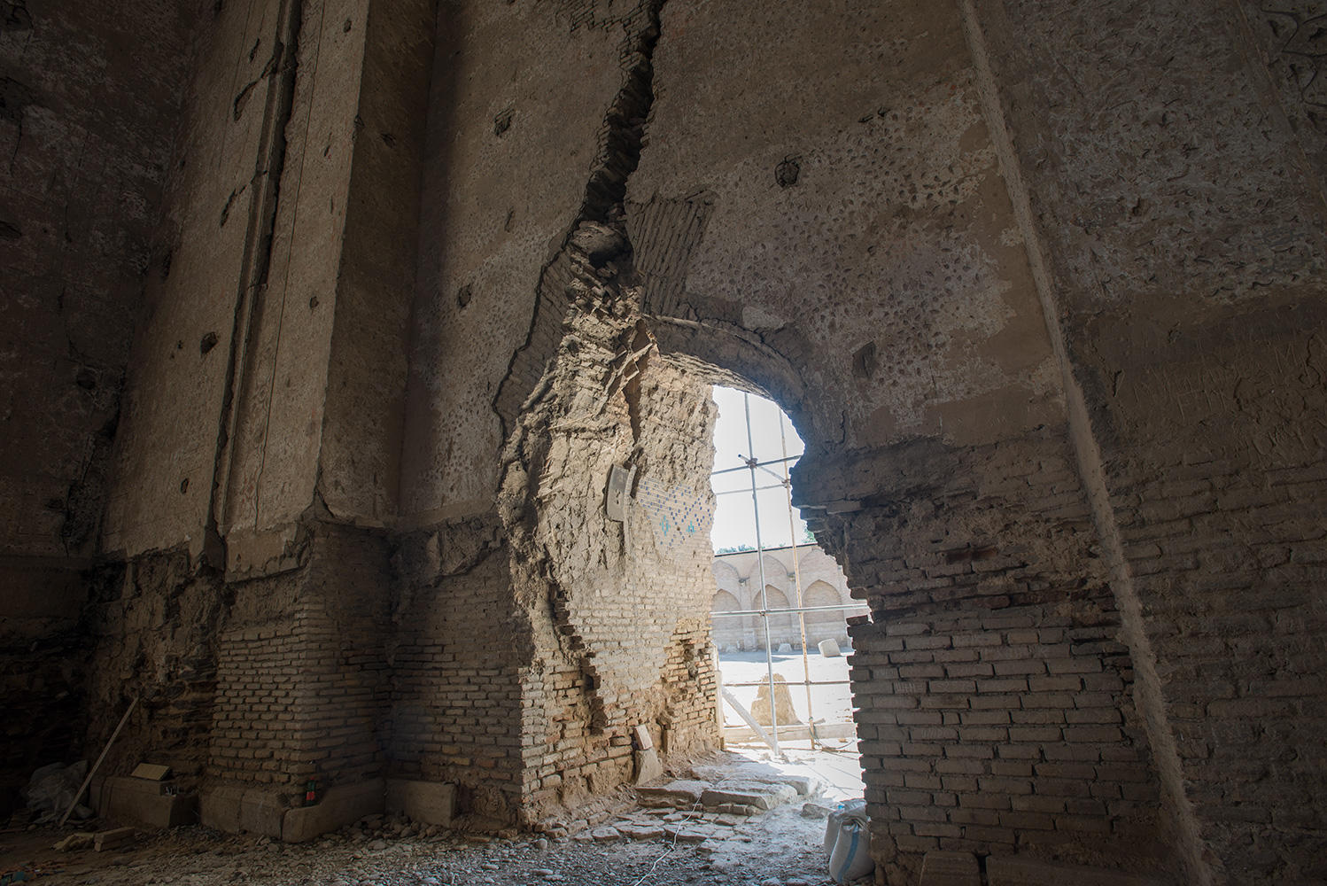 A side entrance to the mani iwan or prayer hall, showing earthquake damage and the challenge facing the restorers of this enormous edifice.