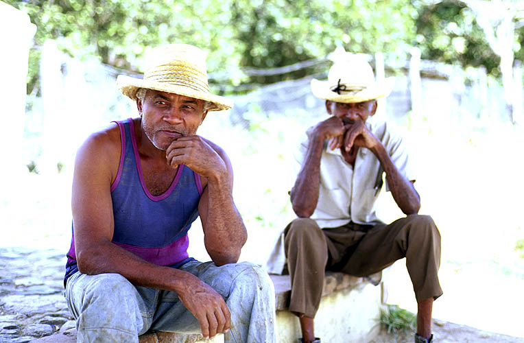 Two sugar estate workers enjoying a midday break in the shade. Hacienda Iznaga is in the Valle de los Ingenios, on the road from Trinidad to Sancti Spiritus.Nikon FM2, 24mm, Fuji Velvia