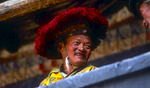 A villager chatting with friends during a break in festival proceedings at the monastery.North-west Nepal.Nikon FM2, 17-35mm, Fuji Velvia 100