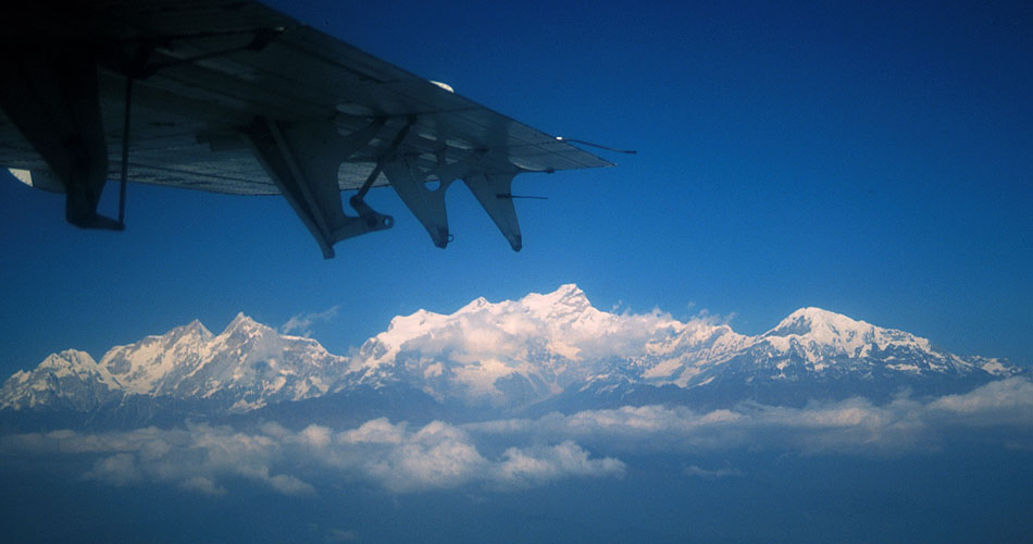 Taken from a Twin Otter flying between Kathmandu and Pokhara, this panorama shows Manaslu (8150m) and Ngadi Chuli (7935m) on the right, and the vast whale-backed hulk of Himalchuli (7893m) in the centre.Nikon FM2, 24mm, Fuji Velvia