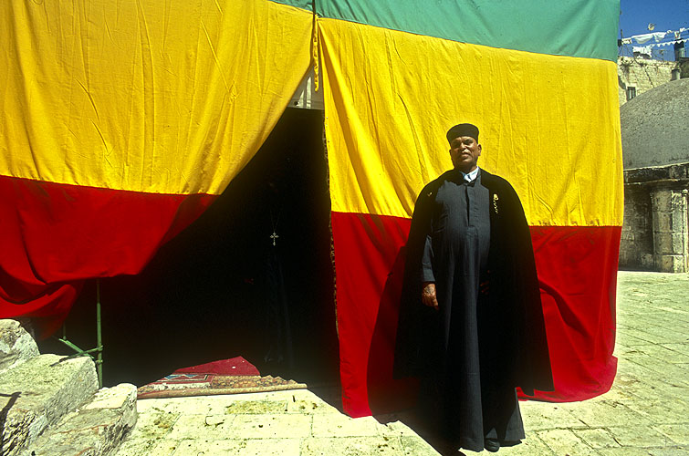 Ethiopian orthodox priest outside the chapel, which is on the roof of the Church of the Holy SepulcherNikon F5, 17-35mm, Fuji Velvia