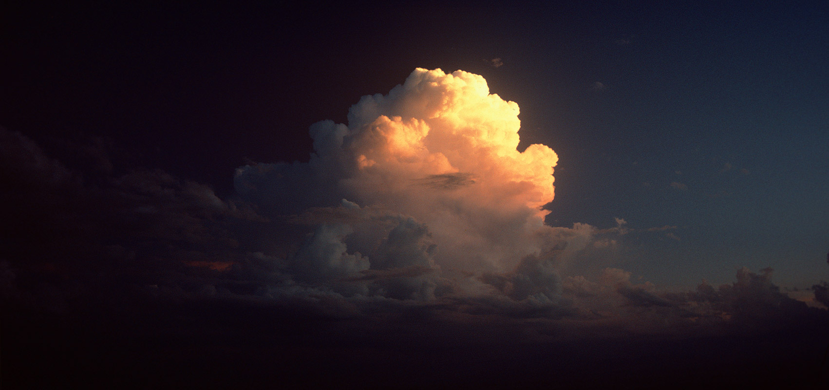 Thunderheads catching the rays of the setting sun over Dal LakeCanon A1, 50mm, Kodachrome 64