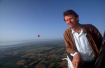 The presenter of {quote}In Search of Myths and Heroes{quote}, high over the Nile valley and the town of Luxor (Egypt) in the basket of a hot-air balloonNikon F5, 17-35mm, Fuji Velvia 100This image © Maya Vision International 2004