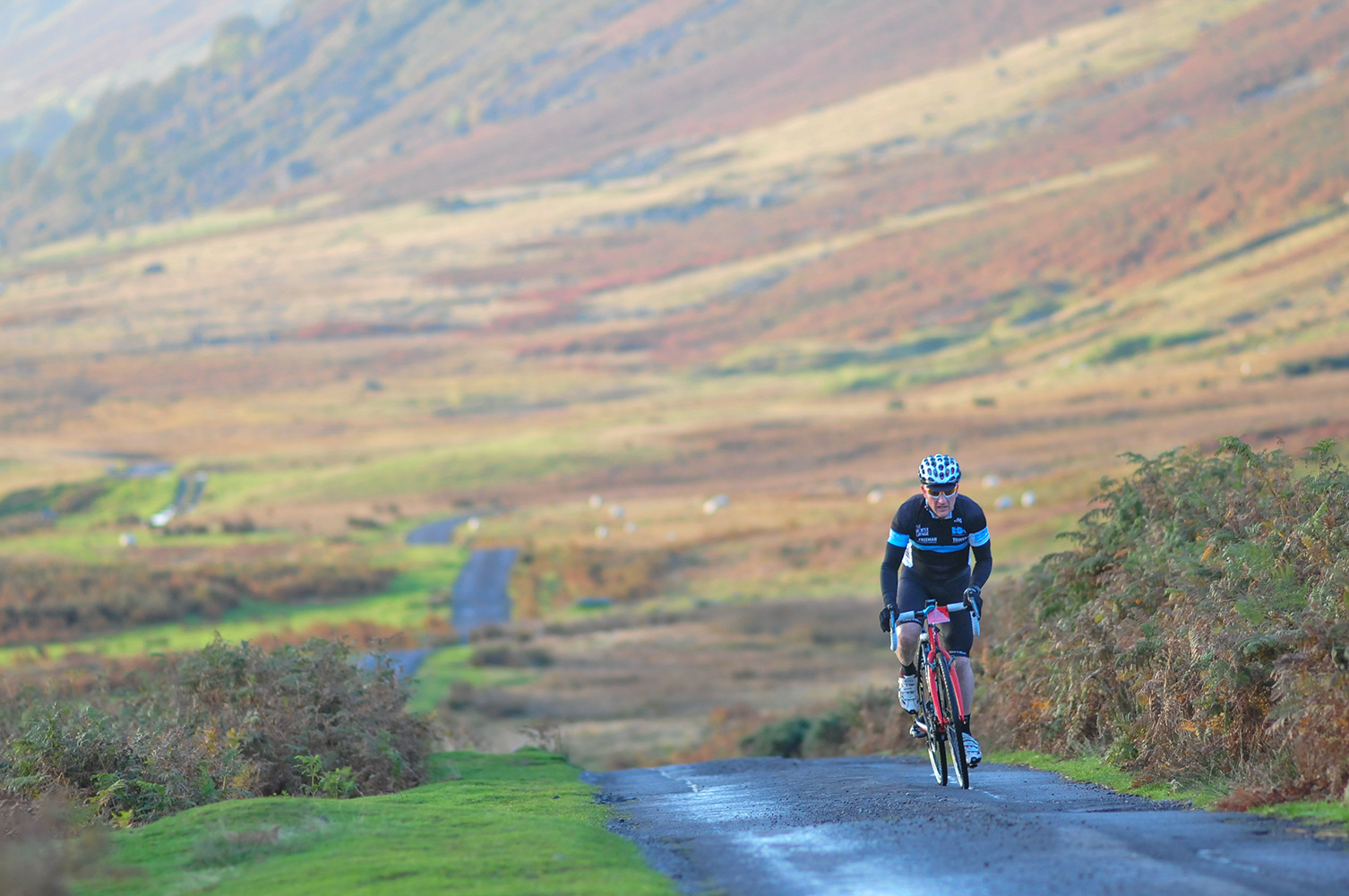 The Monster Miles is a 62 mile (55% off road) Cyclo-Cross Sportive in Cumbria organised by Cycling Weekly and run by Rather Be CyclingHere the leading rider is coming up onto Caldbeck Commons from Mosedale early on a beautiful October morning.