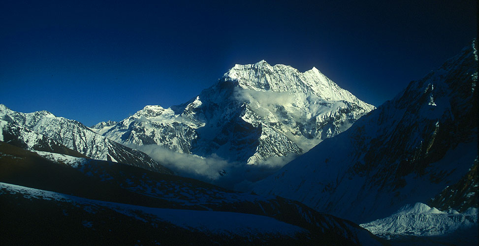 A view back east across Nupri (the upper Buri Gandaki valley) to Pang Puchi from the ascent to the Larkya La. The Gya La route to Tibet is visible to the left.Canon EOS 500, 28mm, Fuji Velvia