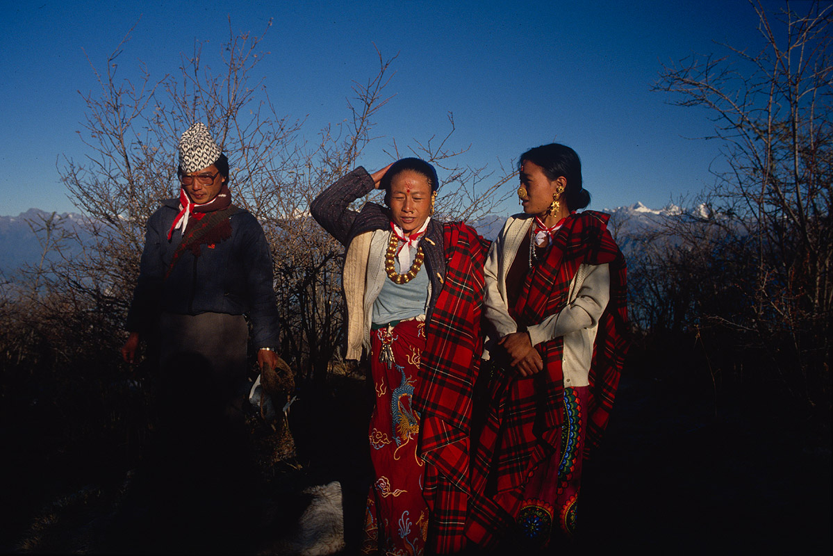 Pathi Bara is a 3700m top just north of Taplejung in Eastern Nepal. There is a tiny Shiva shrine there. At the end of our 1988 trek I spent a night sleeping at the shrine with this family of pilgrims.Canon A1, 28mm, Fuji RFP