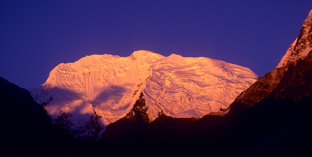 The summit of this peak lies on the border with Tibet. Seen at sunset from Nubama Dhang in the upper Langtang Valley.Nikon FM2, 105mm, Fuji Velvia