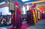 Monks entering the courtyard to perform during the annual tsechu Nikon FM2, 24mm, Fuji Velvia