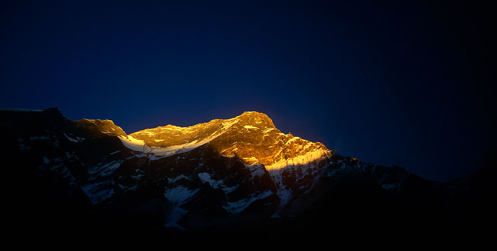 The last rays of sun catching the summit above PuchharNikon FM2, 24mm, Fuji Velvia