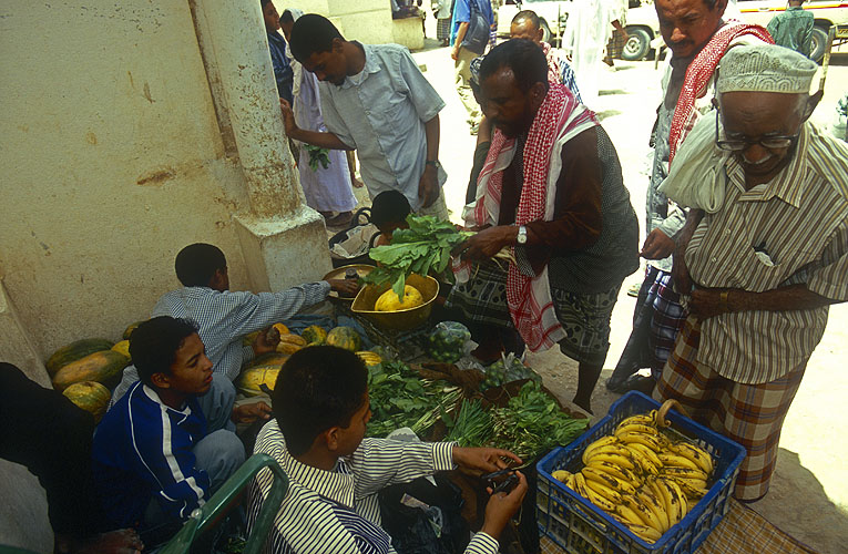 After Friday prayers at the Great Mosque, vegetable sellers ply their trade in the shade of the minaretsNikon F5, 17-25mm, Fuji Velvia 100