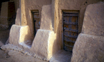 Detail of typical houses,  showing the main doorways and 2m thick bases of the mud-brick wallsNikon F5, 17-35mm, Fuji Velvia