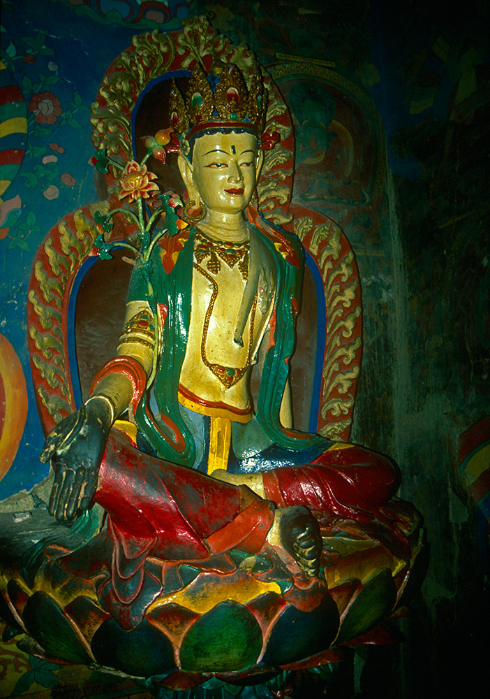 Padmasambhava means {quote}the lotus-born{quote}, and this famous Buddhist teacher is always depicted seated on a lotus flower. The Tibetans call him Guru Rinpoche, and he was instrumental in the spread of Buddhism in Tibet during the 8th century. This statue is at Shigatse.Nikon FM2, 50mm, Fuji Velvia