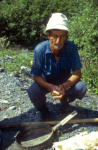 Panning for gold on the Svaneti river. Svaneti has been famous for its mineral wealth for several thousand years, and the use of  a sheep's fleece by gold panners is by no means unique to the Caucasus. Is this behind the myth of the golden fleece?Nikon F5, 17-35mm, Fuji Velvia 100