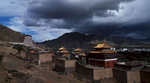 The gilded roofs of this huge monastic complex at Shigatse, under a stormy skyBronica ETRSi, 50mm, Fuji Velvia
