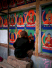 An artist applying gold-leaf to a mural during renovations at the seat of the Panchen Lama in ShigatseBronica ETRSi, 75mm, Fuji Velvia