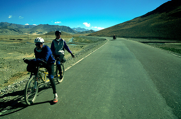 Approaching Tingri on our ride from Lhasa to Kathmandu, we were stunned to find a 3km section of perfect metalled road in the middle of hundreds of kilometers of rough-as-you-like dirt.Nikon FM2, 24mm, Fuji Velvia