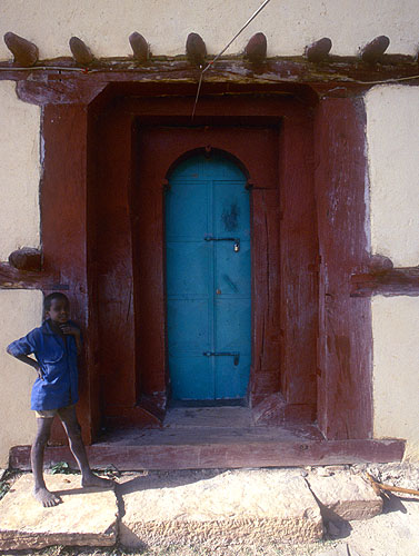 A boy stands at the door to the orthodox church next to the Enda Abuna AfseNikon F5, 17-35mm, Fuji Velvia 100