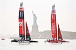 NEWYORK-JUNE22: First place boat Emirates Great Britain and second place Rockwool Den sail past The Statue of Liberty after crossing the finish line in the first race of day one of SailGP off Governors Island, June 20, 2024. ©Radhika Chalasani