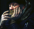 November 2000 -  Homeless man smoking a cigarette.