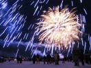 Revelers watch in amazement as fireworks light up the sky celebrating the 50th anniversary of the Caribou Carnival in Yellowknife, NWT, Canada. 