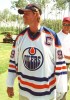 Wayne Gretzky smiles after teeing off in an old style Edmonton Oilers jersey during the Ronald McDonald Children's Charities Wayne Gretzky and Friends Golf Tournament at the Northern Bear Golf Club just southeast of Edmonton. It was the first time since being traded by the Oilers in August of 1988 that he has put on the jersey. Gretzky saw a fan in the crowd wearing the jersey and asked him to take it off for a signiature. Gretzky signed the jersey then proceeded to put the jersey on himself and teed off on the 12th hole with it then gave it back to the happy fan.  Edmonton Sun Photo by Aaron Whitfield