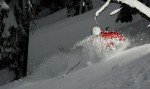     Janelle Miller creates a powder explosion as she digs deep into a turn at Island Lake Lodge, Fernie, BC.