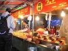 Street vendors are a comon sight in Gukje Market in Busan, South Korea. Vendors sell all sorts of food and brand name clothing at cheap prices. 