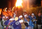 A burning tree is hoisted at the beginning of a festival in Nakatosa, Shikoku. The tree was paraded into the centre of town where teams battled with huge drums during the all night long affair. 